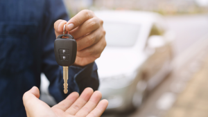 Someone receiving their car keys.